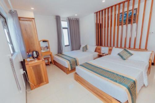 Postel nebo postele na pokoji v ubytování Luxury hotel Phú Yên