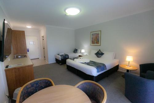 Säng eller sängar i ett rum på Esplanade Hotel Busselton