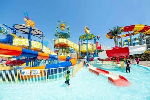 a water park with a water slide and slides at Sugar Marina Seaview Families Suite Apartment in Kuah