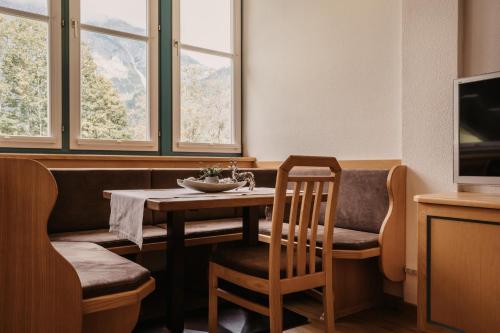 a dining room with a table and a chair at Landhaus Rohrmoser in Werfenweng
