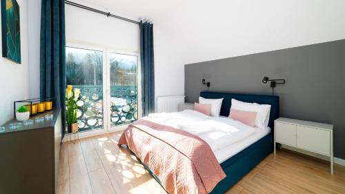 Posteľ alebo postele v izbe v ubytovaní Domki Sun & Snow Sikorskiego