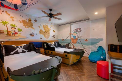 a kids room with two beds and a boat mural at Anantara Vacation Club Mai Khao Phuket in Mai Khao Beach