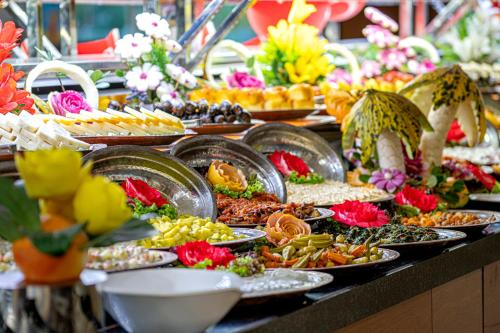 a buffet with many plates of food on a table at Bera Alanya Hotel - Halal All Inclusive in Konaklı