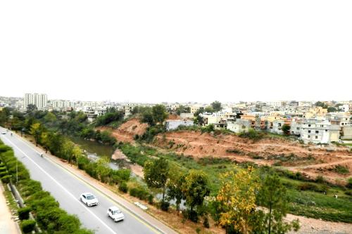an aerial view of a highway in a city at Luxurious Landing Apartments & Suites Bahria Town in Rawalpindi