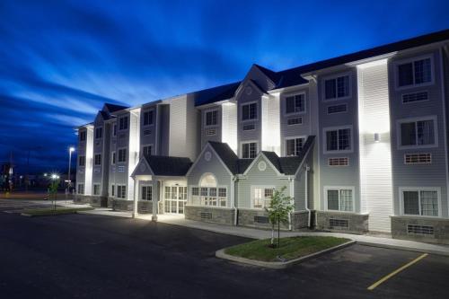 a large white building with a street in front of it at Microtel Inn & Suites Sault Ste. Marie in Sault Ste. Marie