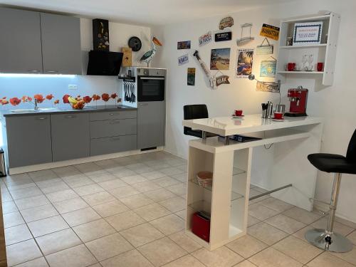 a kitchen with a table and a counter top at Am Wildbach bei Passau in Saming