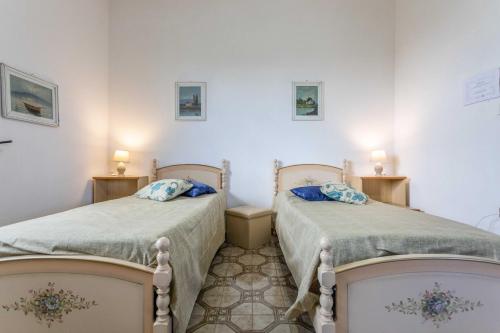 Voodi või voodid majutusasutuse Casa Vacanza Villetta Tiziana 4/6 posti letto toas