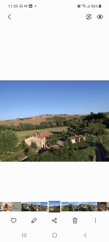 a screenshot of a cell phone with a picture of a house at Molino della Tuoma in San Quirico dʼOrcia