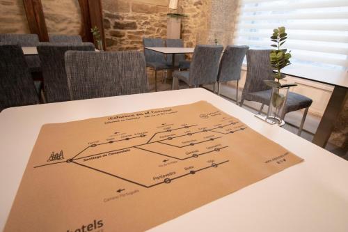 a table with a diagram on the top of it at Hotel Alda San Bieito in Santiago de Compostela
