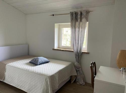 Ένα ή περισσότερα κρεβάτια σε δωμάτιο στο Cammino Nel Verde