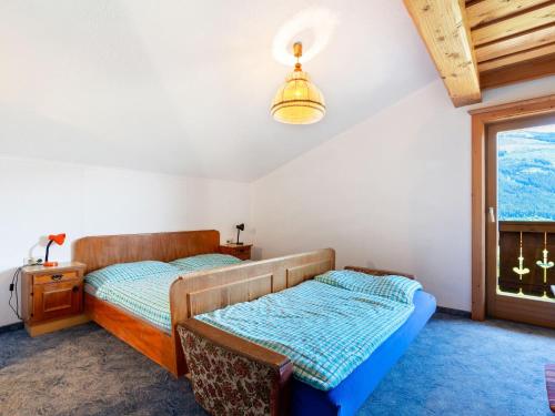 A bed or beds in a room at Warm Apartment in Uttendorf Salzburg near Ski Area