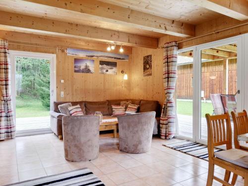 a living room with a couch and a table at Chalet in Stadl an der Mur near the ski area in Stadl an der Mur