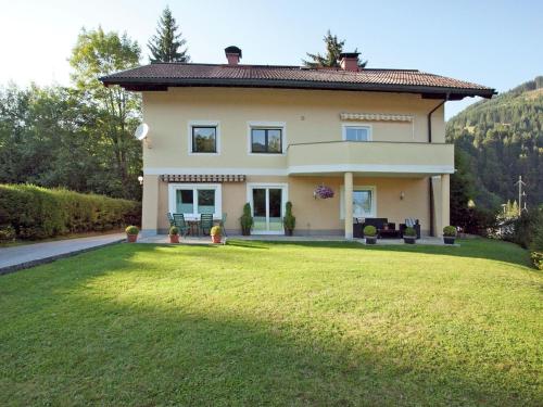 a house with a large lawn in front of it at Apartment with terrace in Salzburg in Lungötz