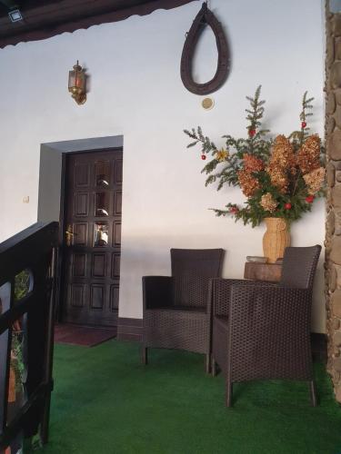 a room with a table and chairs and a door at Pokoje Gościnne Angelika in Wisła