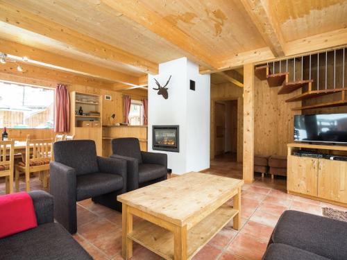 a living room with a couch and a table at Chalet near the Kreischberg ski area in Stadl an der Mur
