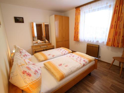 a bedroom with two beds and a window at Chalet in Sankt Johann near Ski Lift in Wagrain