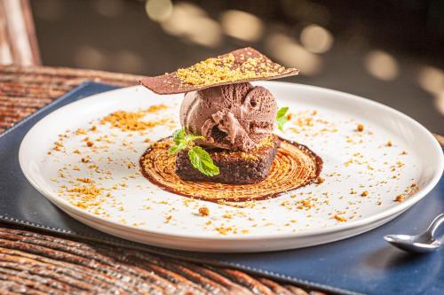 a chocolate dessert on a plate on a table at Eco Luar Boutique Hotel in Igarassu