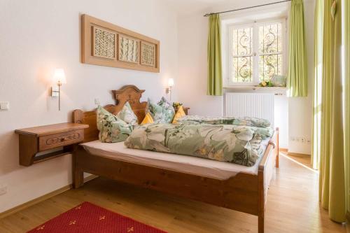 Кровать или кровати в номере Ferienwohnungen Haus Sonnenwinkel