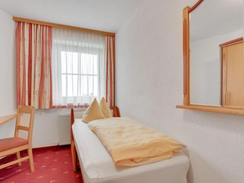 Postel nebo postele na pokoji v ubytování Apartment in Hainzenberg near Ski Lift