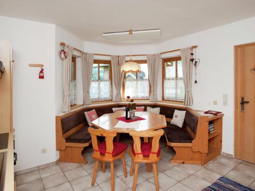a dining room with a table and chairs at Animal friendly apartment in Leogang in Leogang