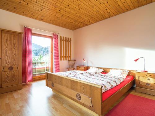 A bed or beds in a room at Picturesque Apartment in Thomatal Salzburg near Forest