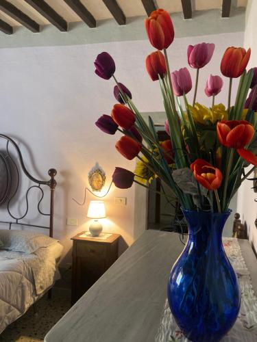 Postel nebo postele na pokoji v ubytování Casa Vacanze Beppina Cortona