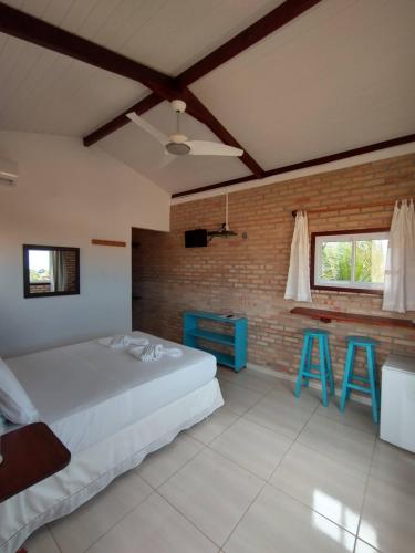 A bed or beds in a room at Vila Beija-flor