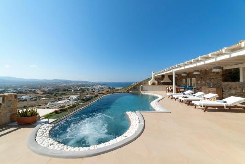 a swimming pool on top of a building at Naxos Rock Villas in Stelida