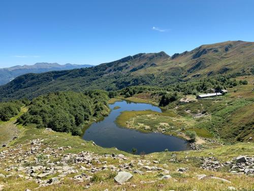 a pair of reservoirs on the side of a mountain at Nidi del faggio rosso - Family Holiday Home in Maresca