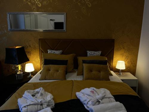 a bedroom with a bed with towels on it at Studio Apartment Sofia - Poreč Old Town Quiet Oasis with FREE parking in Poreč