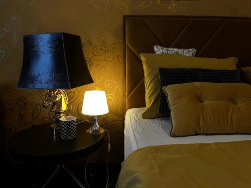 a bedroom with a bed and a lamp on a table at Studio Apartment Sofia - Poreč Old Town Quiet Oasis with FREE parking in Poreč