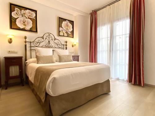 Postel nebo postele na pokoji v ubytování Hostal Rodri