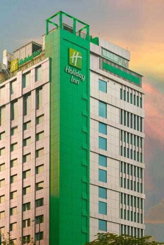 a building with a sign on the side of it at Holiday Inn Dhaka City Centre by IHG in Dhaka