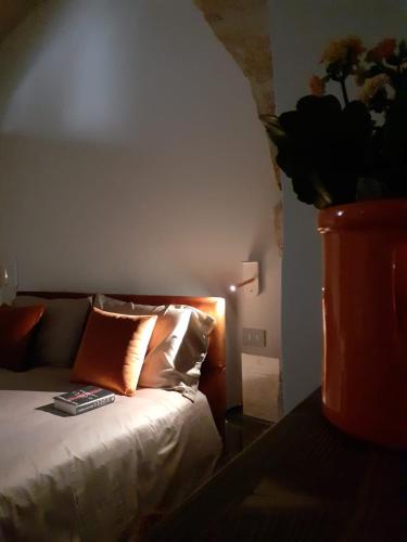 a bedroom with a bed with a lamp on it at MATTEI LUXURY B&B in Altamura