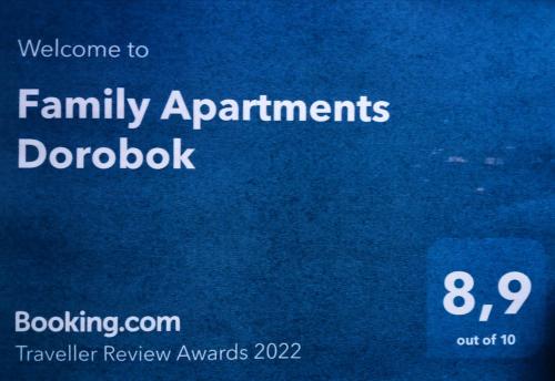 a sign with the words family at Family Apartments Dorobok in Lviv