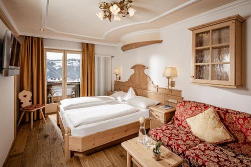Postel nebo postele na pokoji v ubytování Romantik & Family Hotel Gardenia***S