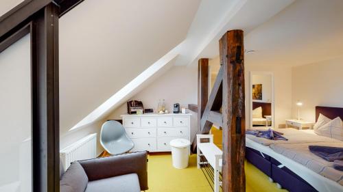 a bedroom with a bunk bed and a staircase at Schönhagener Mühle in Pritzwalk