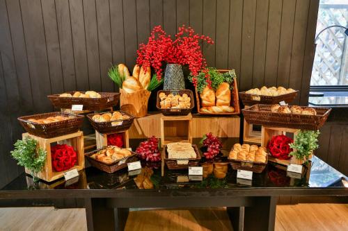 a display of bread and pastries on a table at Transamerica Executive Jardins in Sao Paulo