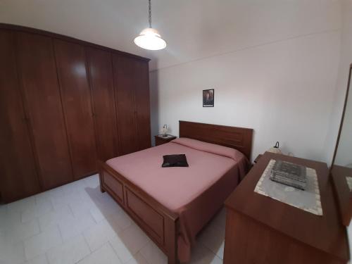 מיטה או מיטות בחדר ב-Appartamenti Vacanza al centro
