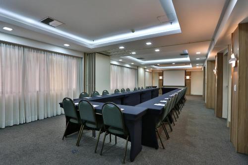a conference room with a long table and chairs at Transamerica Executive Jardins in Sao Paulo