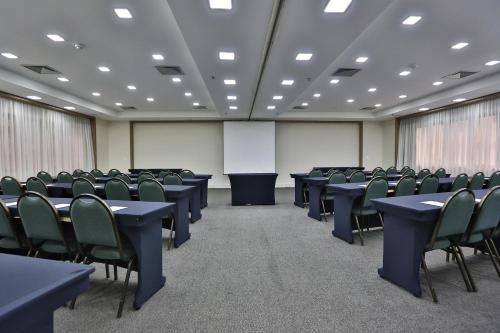 a conference room with tables and chairs in it at Transamerica Executive Jardins in Sao Paulo