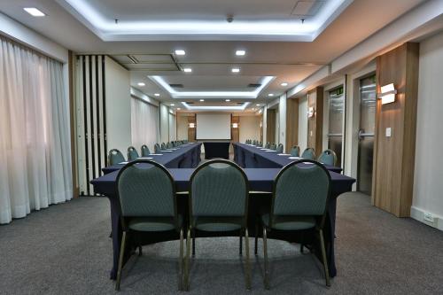 a conference room with a long table and chairs at Transamerica Executive Jardins in Sao Paulo