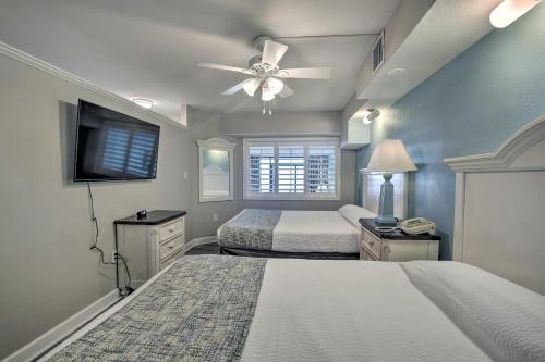 a bedroom with two beds and a ceiling fan at Oceanfront Condo with Views in North Myrtle Beach! in Myrtle Beach