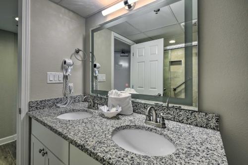 a bathroom with two sinks and a large mirror at Oceanfront Condo with Views in North Myrtle Beach! in Myrtle Beach