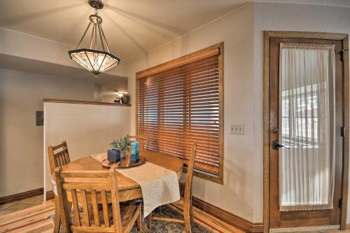 a dining room with a table and chairs and a window at Charming Joliet Ranch House on a Working Farm in Silesia