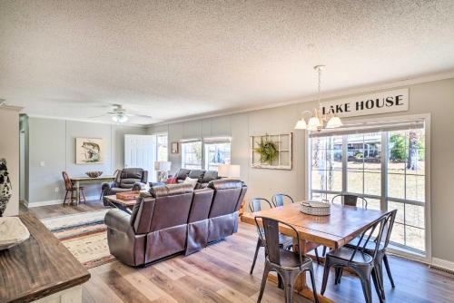 a living room with a couch and a table at Cypress Point Spacious Home Pier and Boat Launch! in Alliance
