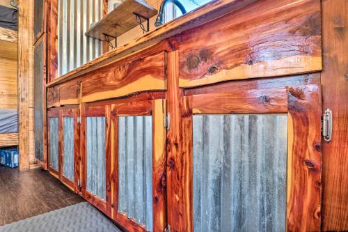 a wooden cabin with two doors in a room at Sunny Catfish Cabin with Views of Toledo Bend in Alliance