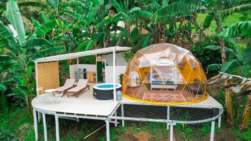 a round house with a tent on top of it at Bajo el Cielo Glamping San Francisco in San Francisco