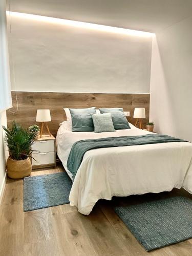 Postel nebo postele na pokoji v ubytování Suite Centro Pontevedra