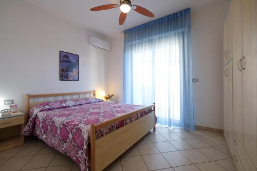 En eller flere senger på et rom på Green Bay A7 - Pineto Vacanza
